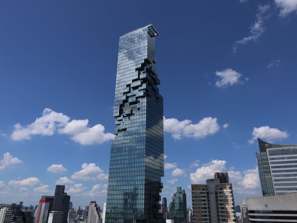 The Mahanakhon tower in Bangkok against a blue sky